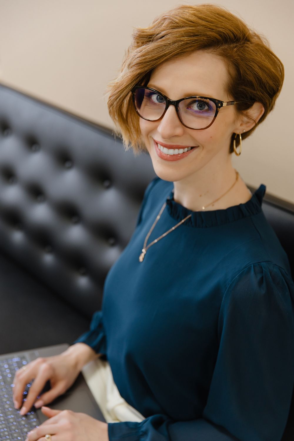 Amanda M. Hadlock writing at her laptop
